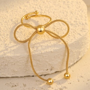 Bague Lou ajustable dorée avec grand nœud en chaîne souple