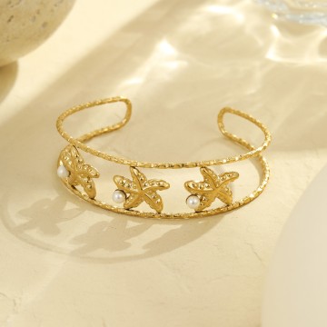 Bracelet Jonc Stella doré double rang avec trois étoiles de mer